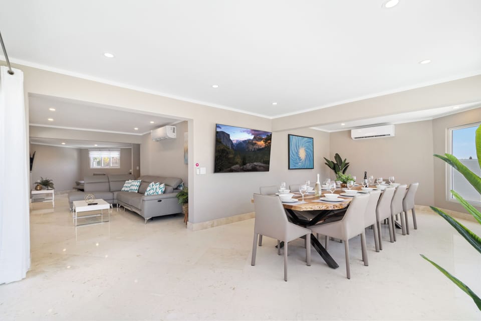 Resplendent Dining and Living Area of the Villa in Noord Aruba - Open-concept living area seamlessly connected to a stylish dining space -  Effortlessly combines sophistication, comfort, and functionality