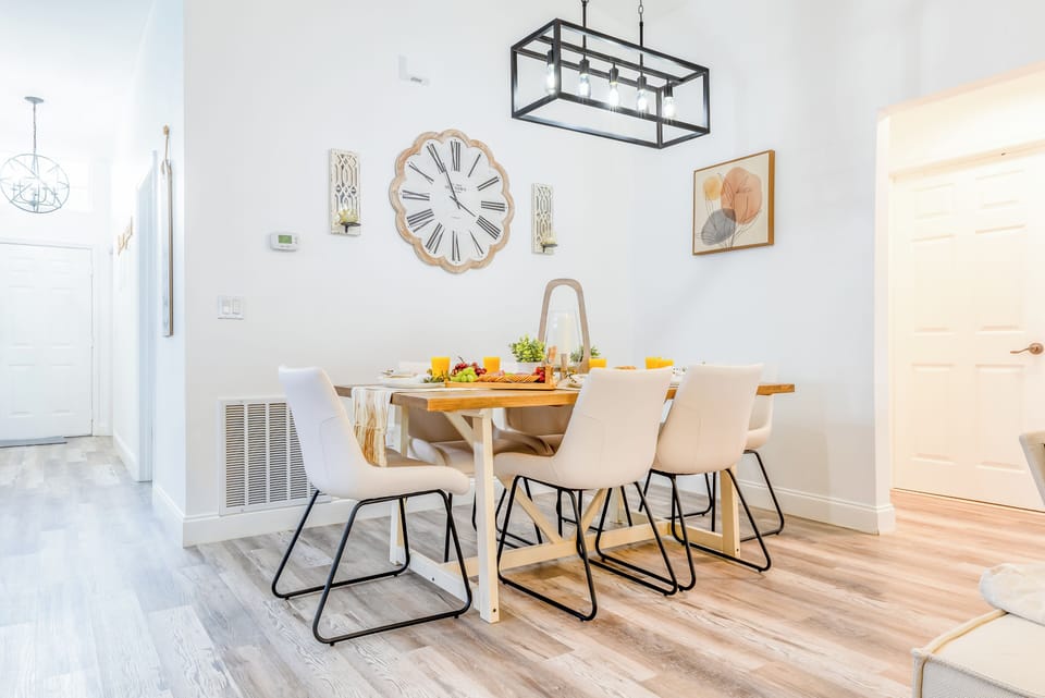Dinning table seat six with additional seating in the kitchen island and patio.