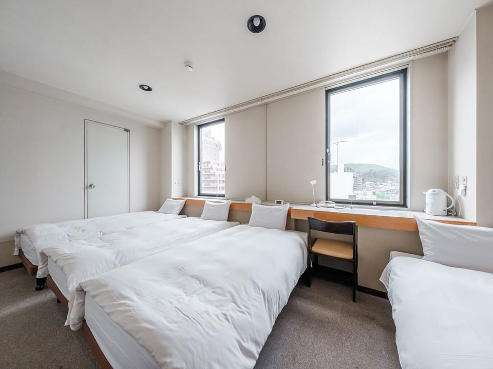 Standard Quadruple Room, 4 Bedrooms | Desk, bed sheets