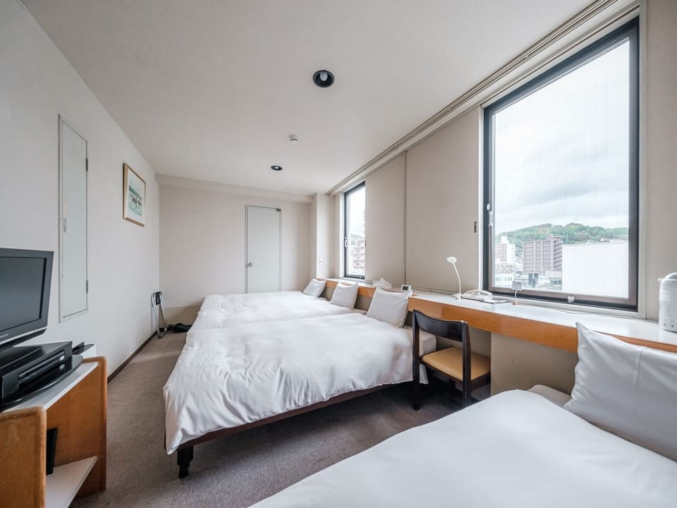 Standard Quadruple Room, 4 Bedrooms | Desk, bed sheets