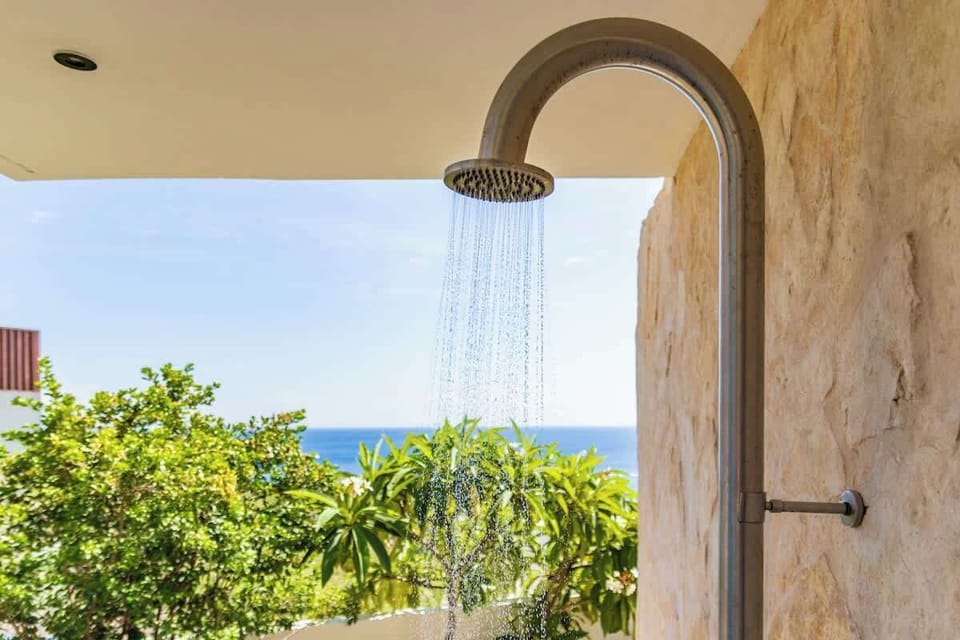 Refresh after the beach or pool with this open-air rain shower, surrounded by tropical greenery and ocean views. It’s the little luxuries like this that make island living feel effortless.