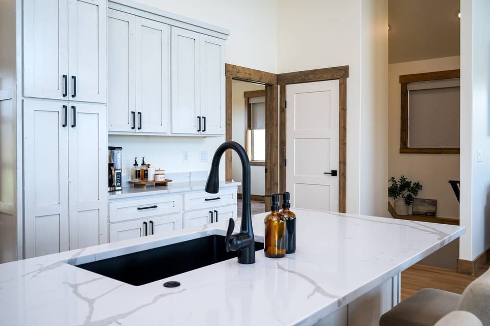 Indulge in culinary delights in the cozy kitchen, equipped with ample amenities for creating wonderful dinners with friends and family.
