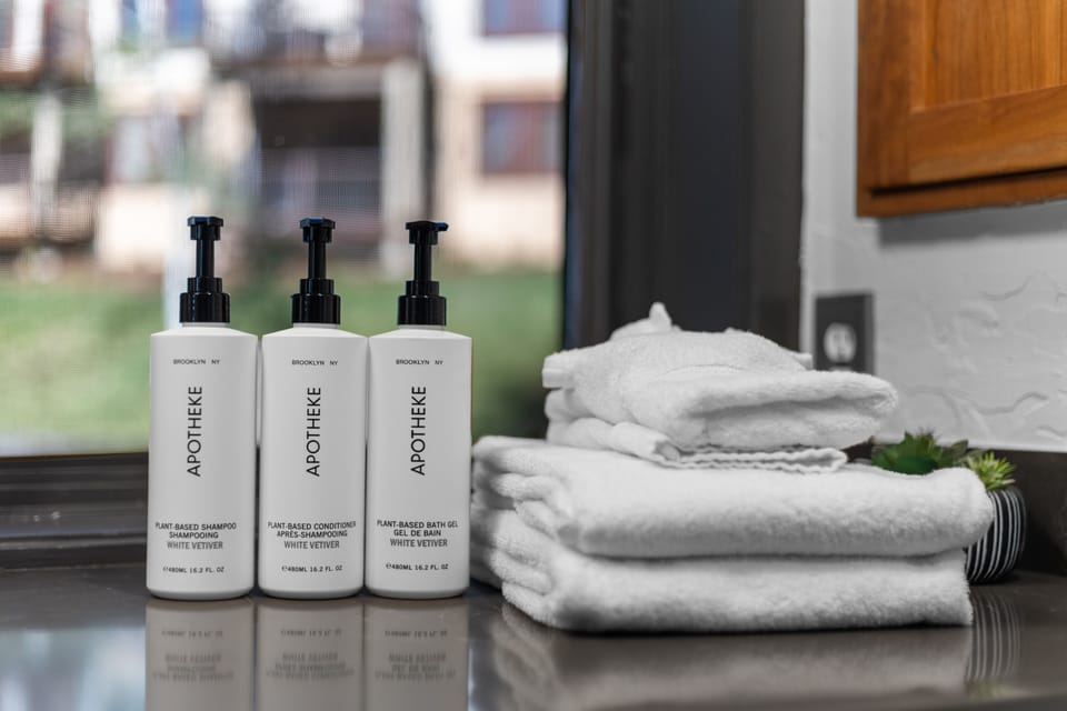 Upscale shampoo, conditioner and body wash in full-size bottles.