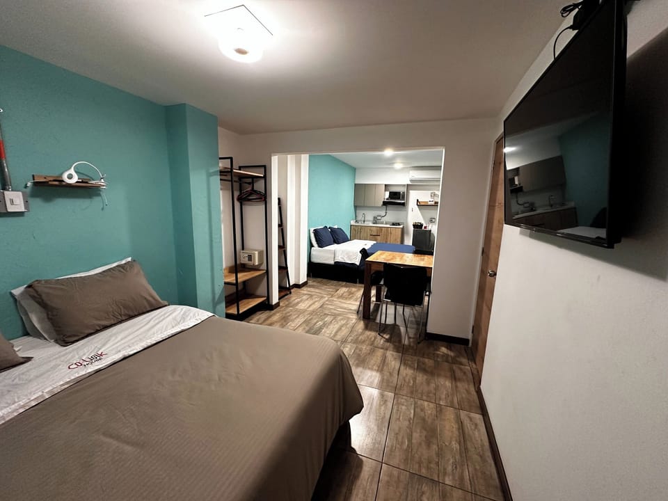 Standard Studio, 2 Queen Beds, Private Bathroom | In-room safe, laptop workspace, free WiFi, bed sheets
