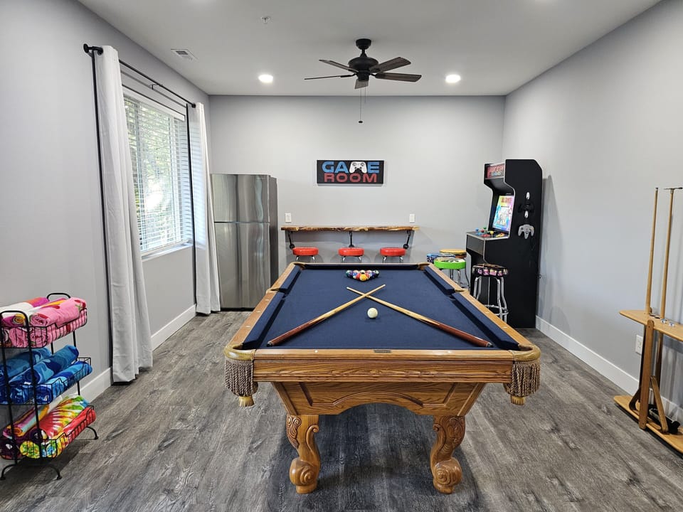 Game room with pool table for friendly family competition.