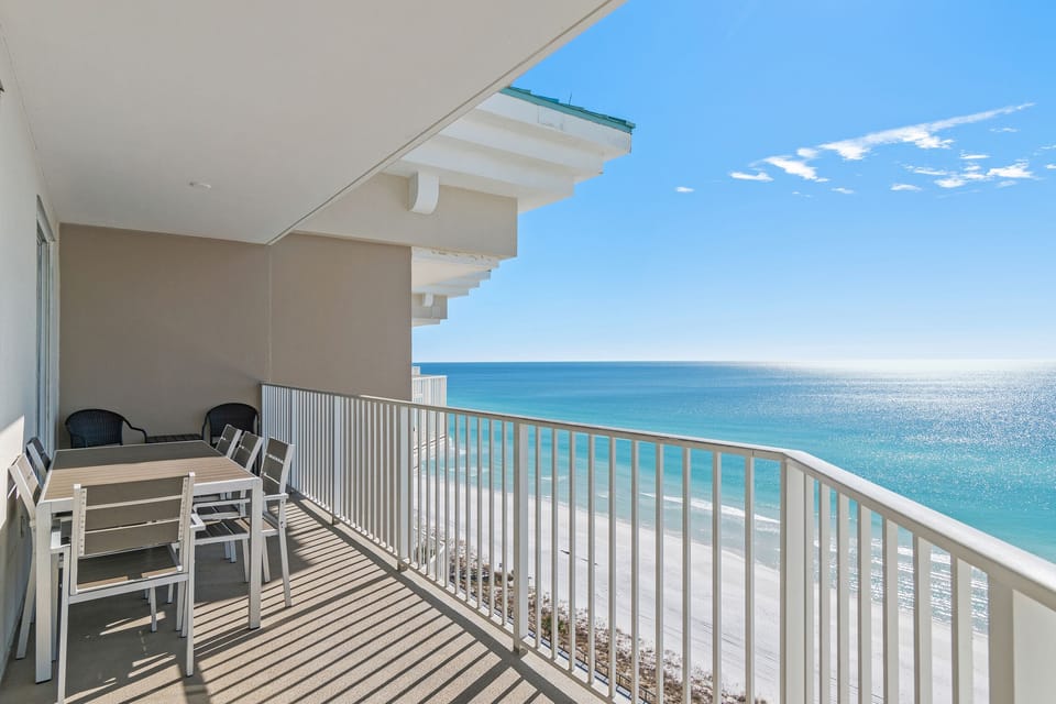 Spacious patio with plenty of seating, perfect for soaking in those Emerald Coast Views - accessible from the living room AND Master bedroom