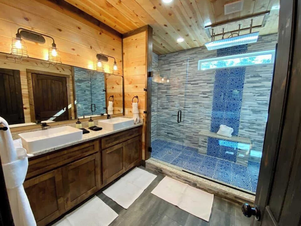 In bathroom 2 as well, dual vanities serve as your hub for prepping, whether for adventures or movie nights. 