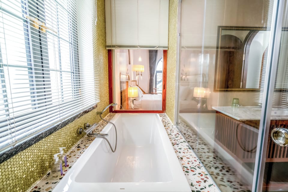 Luxury Double Room | Bathroom | Combined shower/tub, rainfall showerhead, hair dryer, slippers