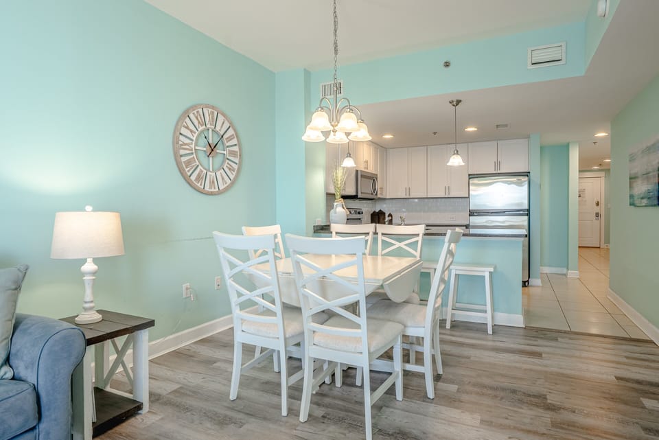 Dining table can seat up to 4. There are also 4 barstools at the counter