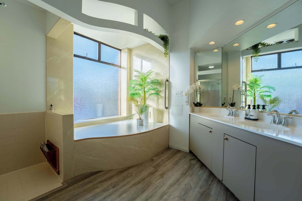 Full bathroom with double vanity & glass shower