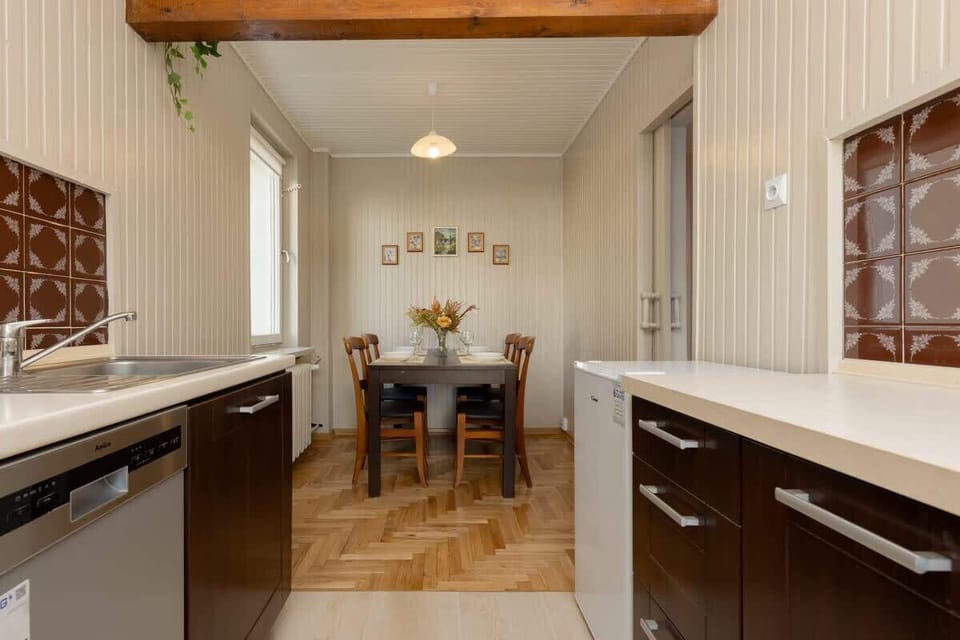 Kitchen with oven and refrigerator. 