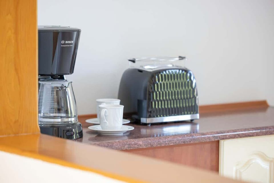 Close-up of the coffee station, complete with a coffee maker and toaster -everything you need for a quick breakfast.

