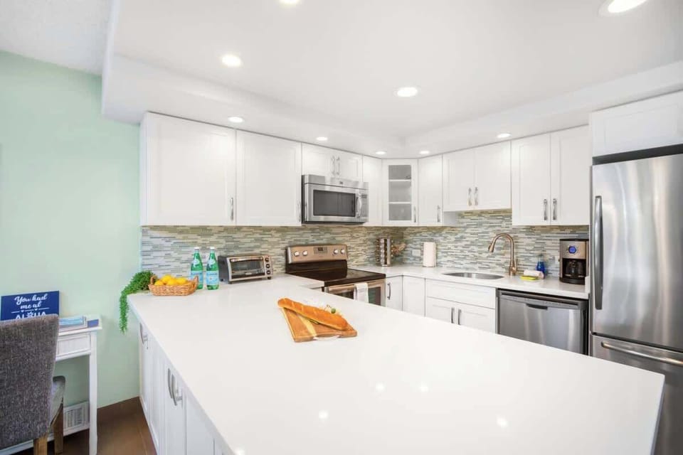 Fully equipped kitchen with countertop, and full-size appliances.