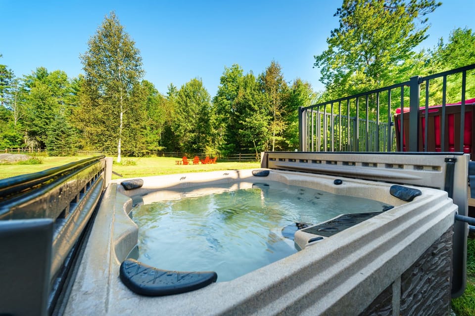 Luxuriate in our 6-person hot tub located just off the back deck and soak in views of the beautiful backyard and Jay Mountain Range