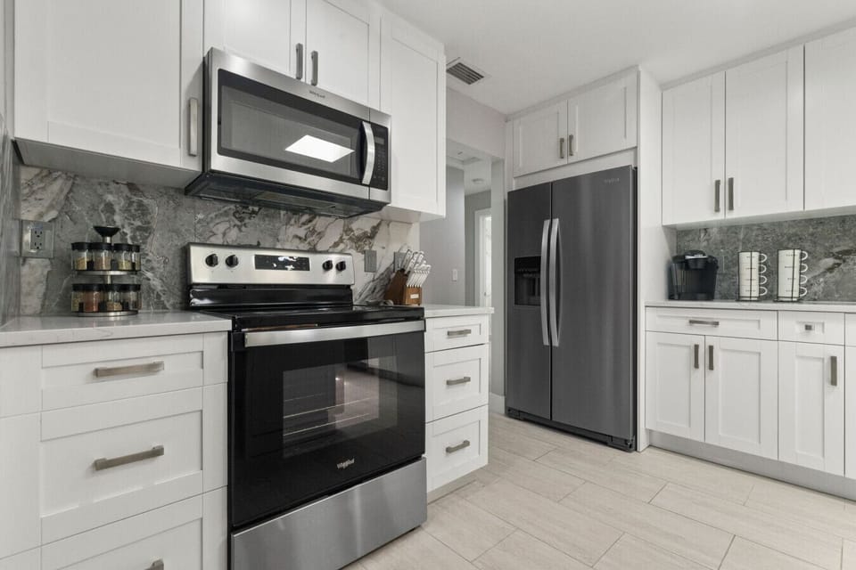 Modern kitchen with stainless steel appliances and sleek finishes