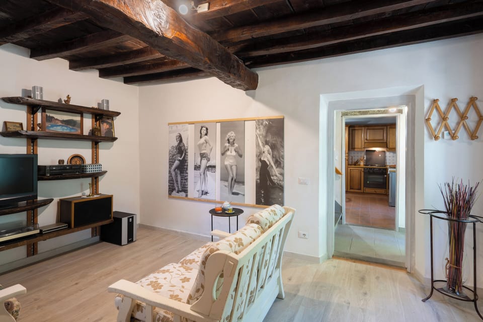 Villa | Living area | 32-inch TV with satellite channels, fireplace