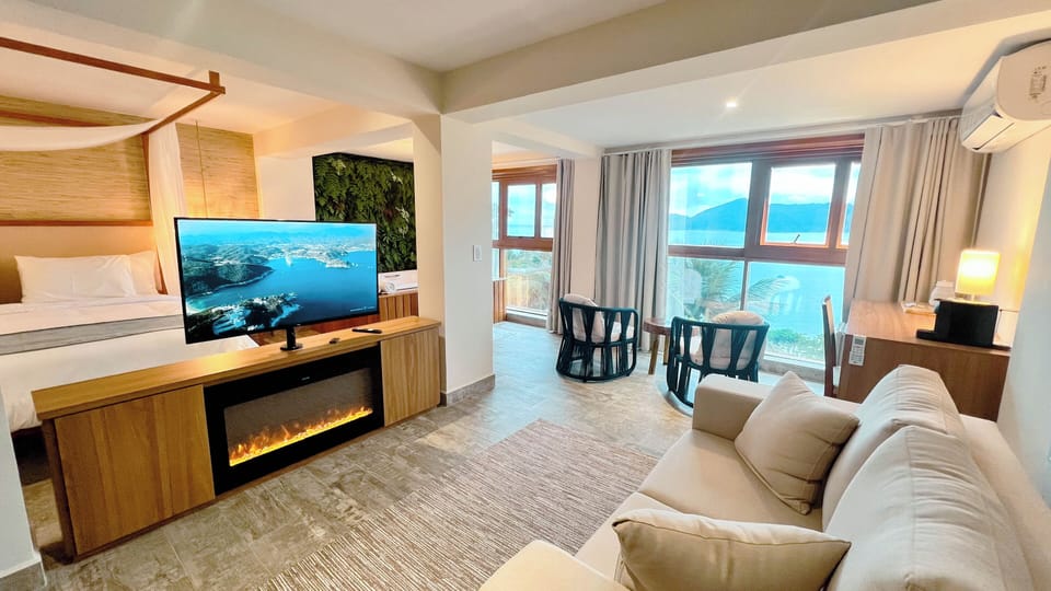 Deluxe Suite, 1 King Bed, Sea Facing | Living area | 32-inch Smart TV with digital channels, Netflix, streaming services