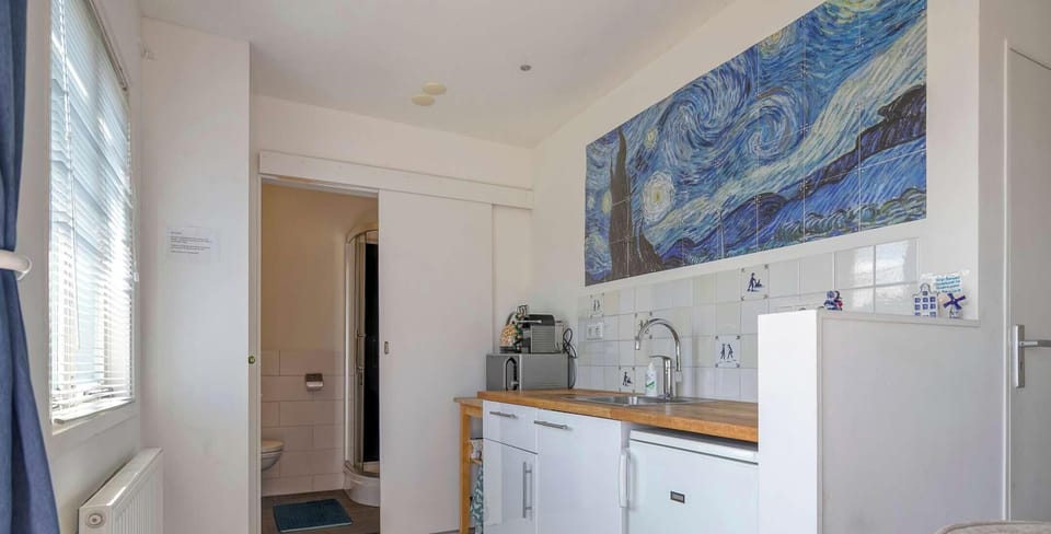Kitchenette and bathroom entrance