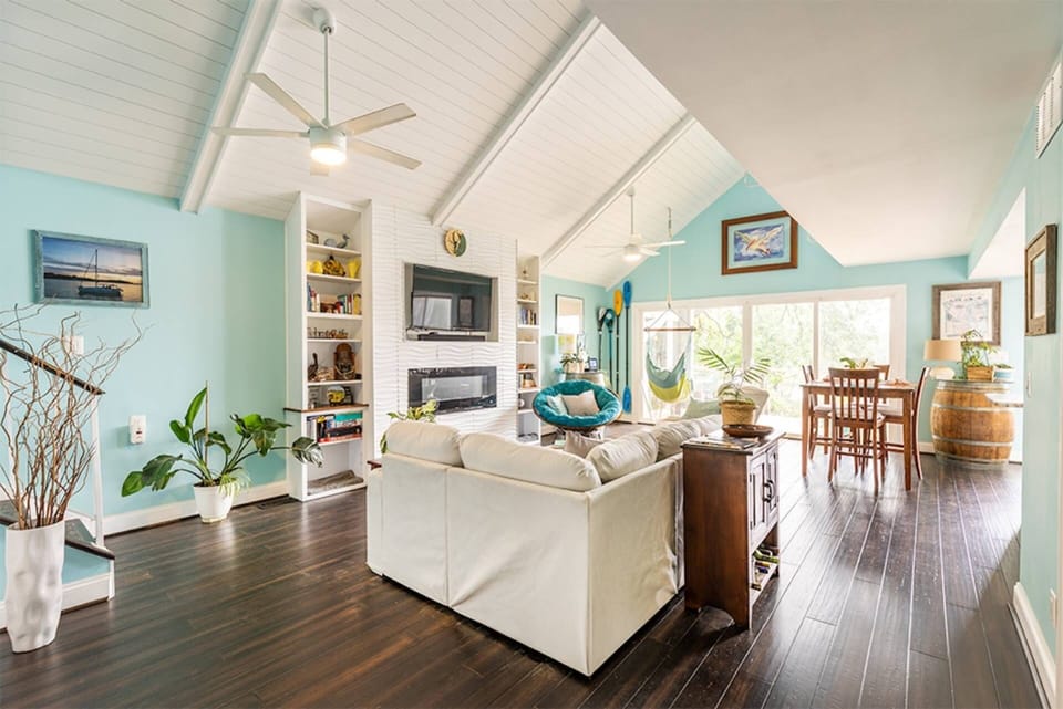 The open living room with high ceilings will make you feel like you've entered a luxury spa.