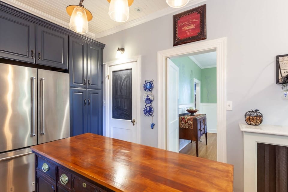 There's plenty of space in the double-sided fridge and freezer.  Behind the door is the full-size washer and dryer.