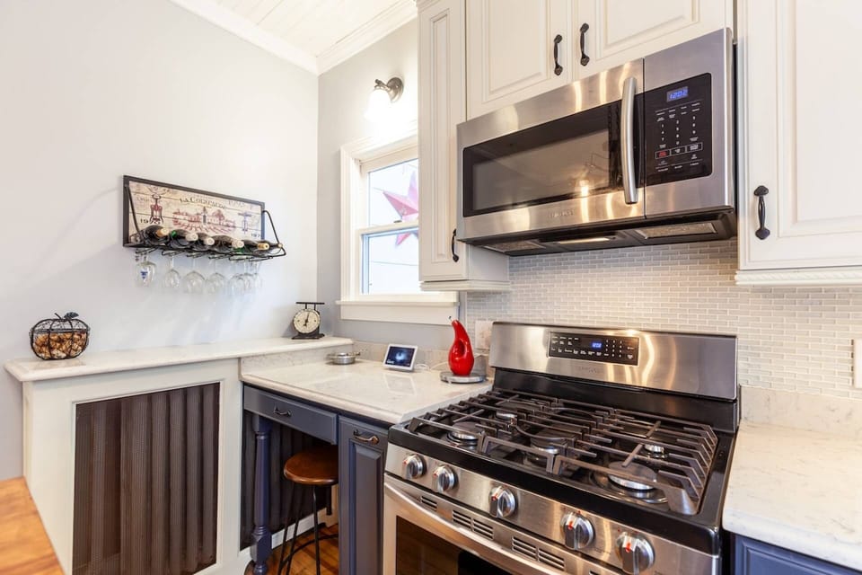 The stainless steel gas range and microwave.