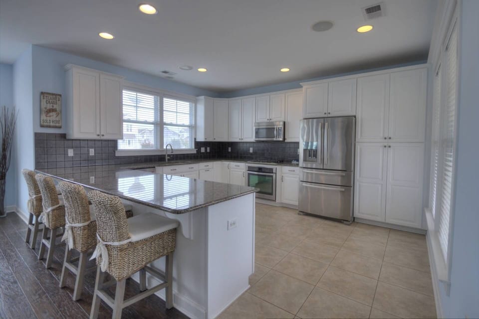 Sit at the kitchen bar while everyone cooks together.