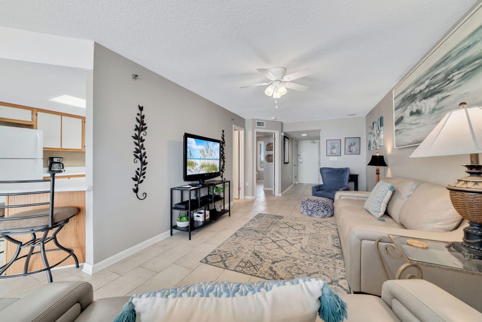 Spacious living area with a sleeper sofa and direct balcony access to the beach. Your ideal vacation retreat!
