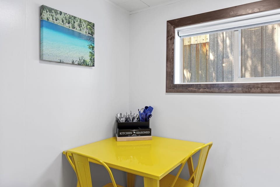 Kitchen table with cooking and eating utensils