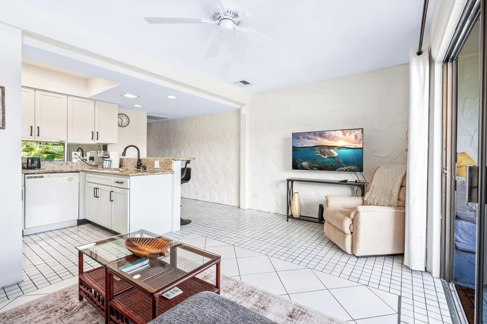 Comfortable and stylish living room with ocean-inspired décor, perfect for relaxing after a day on the Kona Coast.