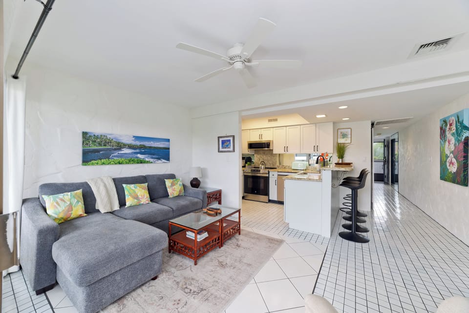 Bright and inviting living room with comfortable seating and queen sofa sleeper.