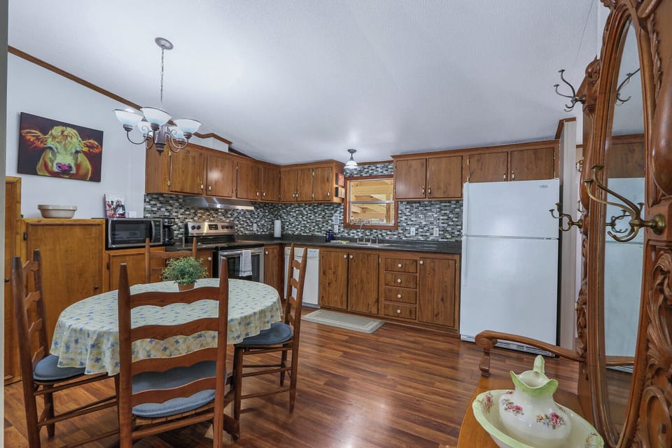 The open kitchen with a seating area blends functionality and southern style