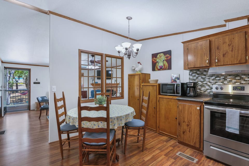 The kitchen is conveniently situated off of the living room and has formal seating