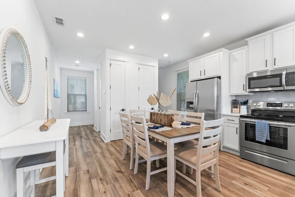 Make yourself at home in this open kitchen with new appliances, a drip & K-Cup coffee maker, cookware, and plenty of seating for meals or morning coffee.