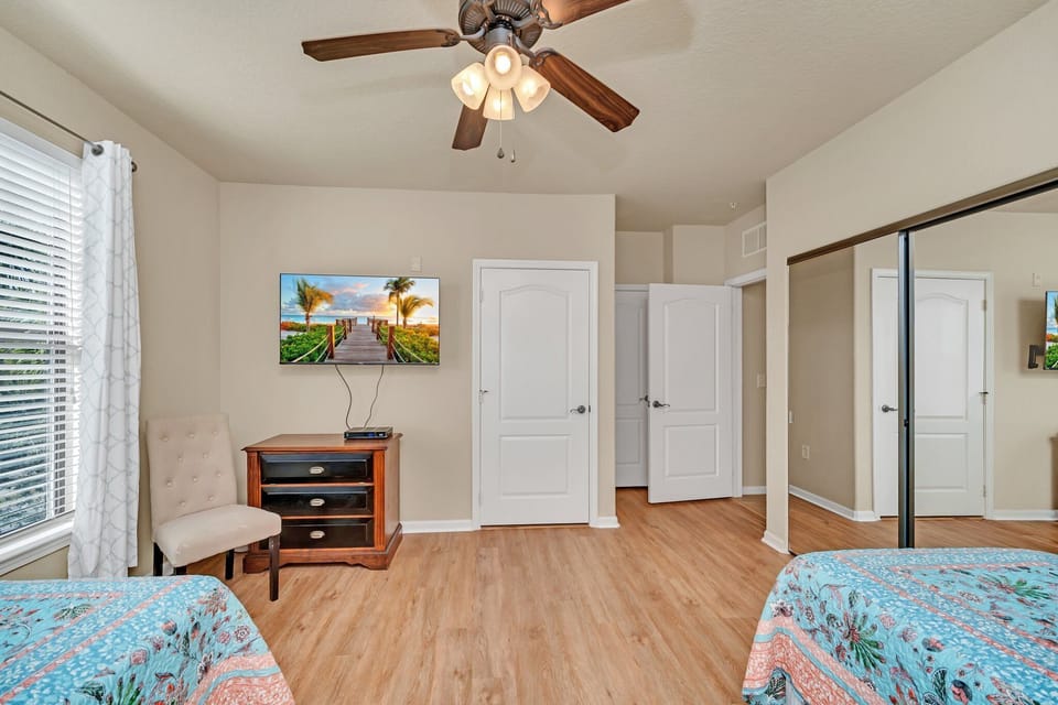 Natural light pours into the cozy guest space, complete with elegant fixtures and modern floors throughout.