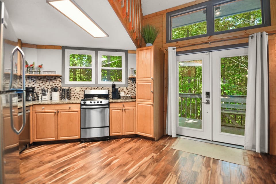 Kitchen with double doors leading to deck with valley views 