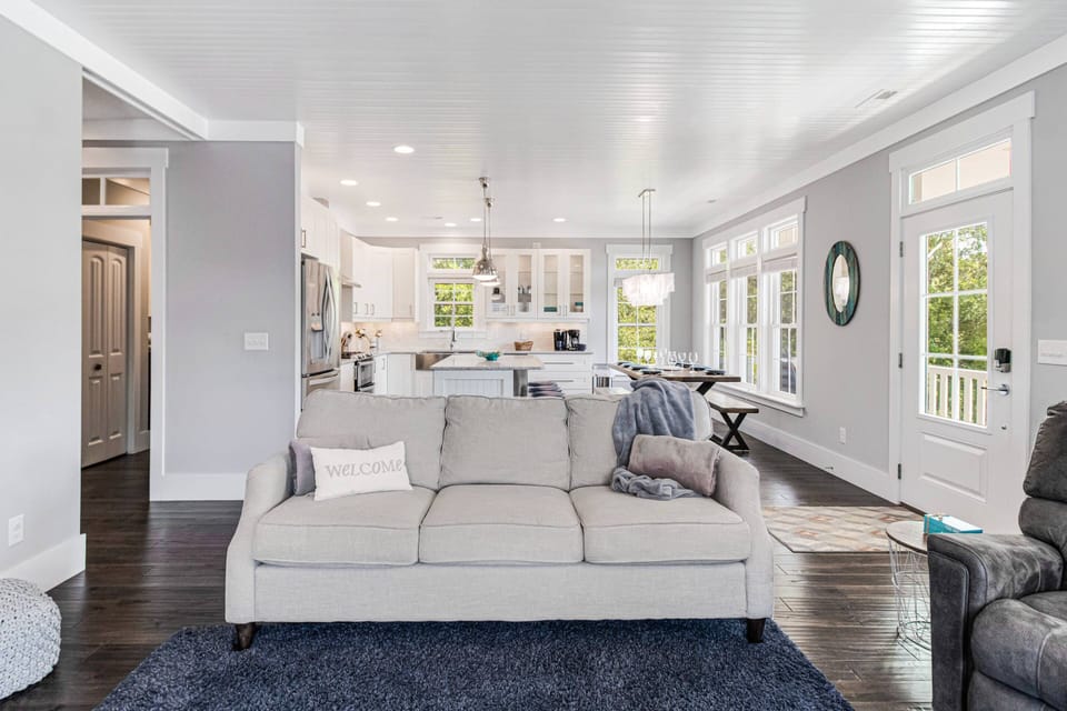In this Open Plan Living/Kitchen/Dining Area are So Many Large Windows which allow Natural Light to Flood this Large Space.