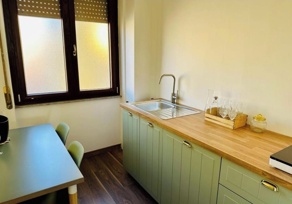 Family Condo | Private kitchen | Full-size fridge, stovetop, electric kettle, cookware/dishes/utensils