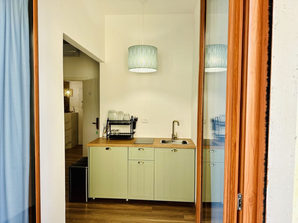 Panoramic Quadruple Room, Sea View | Private kitchen | Full-size fridge, stovetop, electric kettle, cookware/dishes/utensils