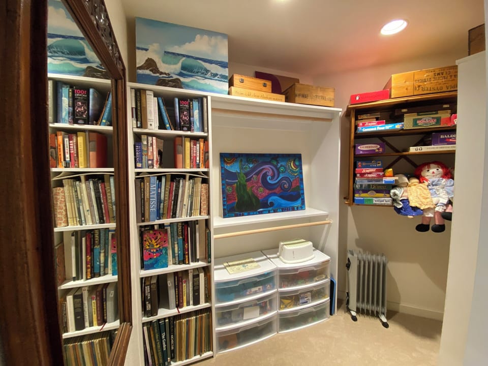 Books, games, toys in the upstairs bedroom.