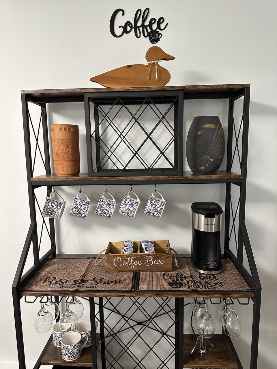 coffe bar with coffee  maker, and coffe, creamer and snacks