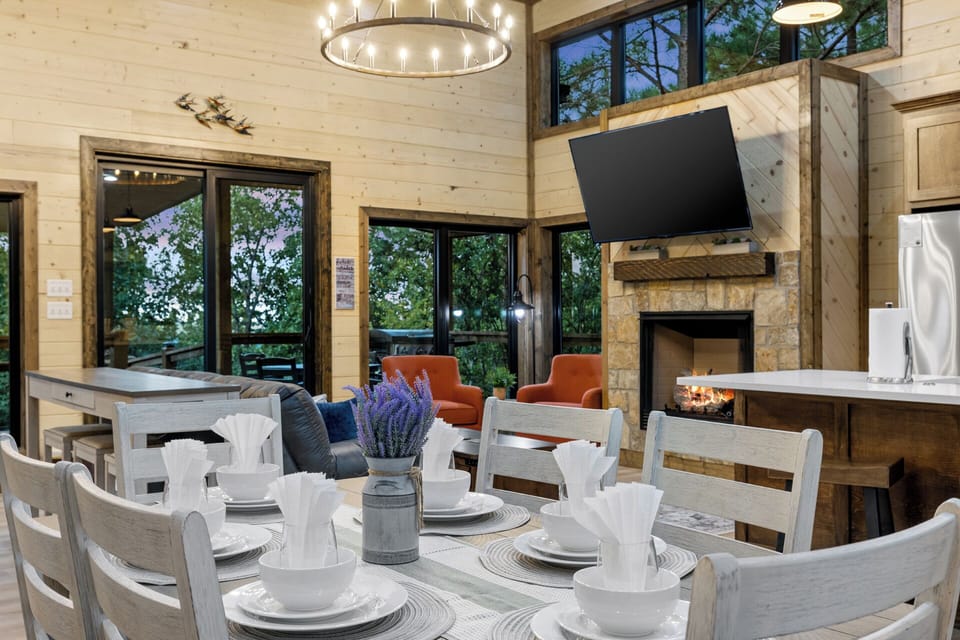 Indulge in meals and entertainment with a kitchen table that offers both a great view and a TV.