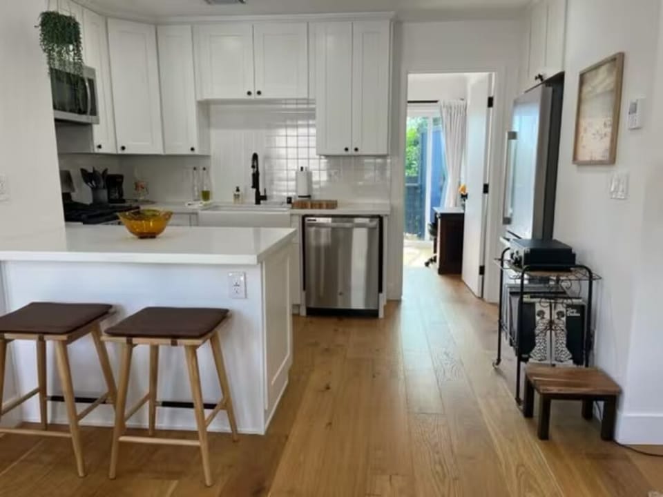 Kitchen to primary bedroom and back patio area