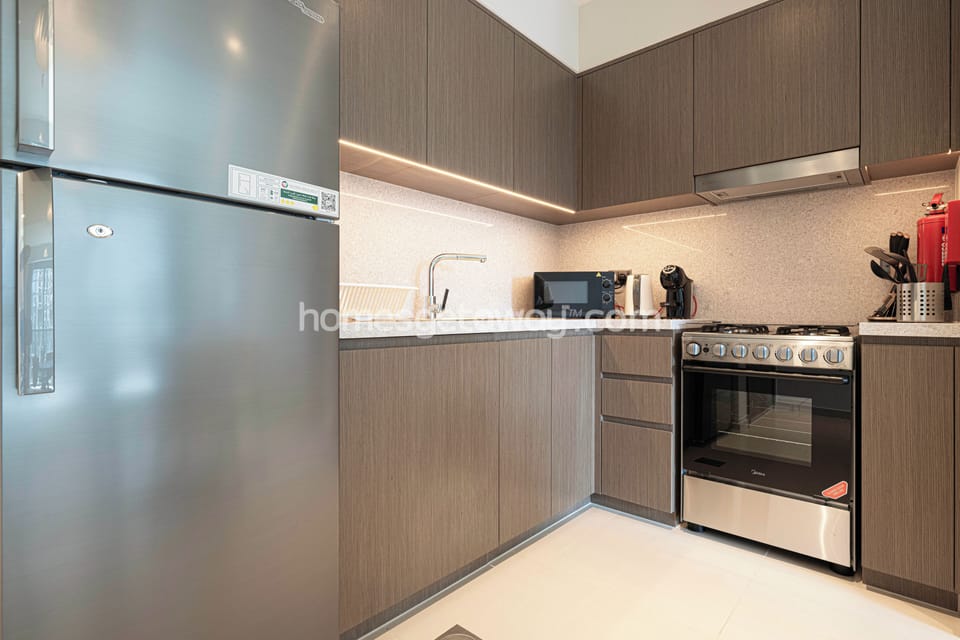 Deluxe Apartment | Private kitchen | Fridge, microwave, coffee/tea maker, electric kettle
