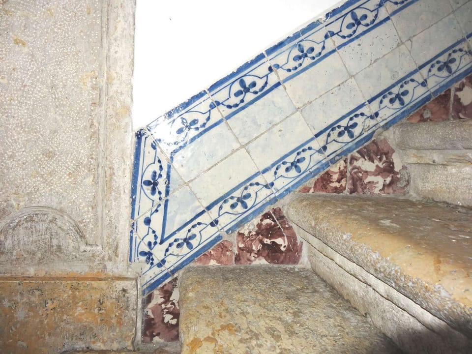 The building has a beautiful tiled stairwell
