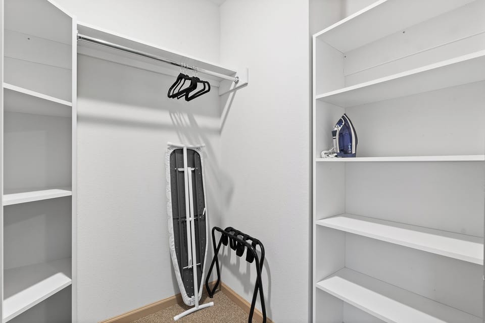 Closet with ironing board and iron