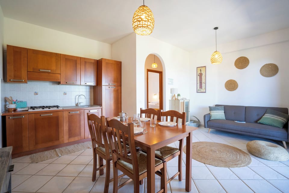 Deluxe Apartment, 2 Bedrooms, Terrace, Sea View | Private kitchen | Full-size fridge, coffee/tea maker, cookware/dishes/utensils
