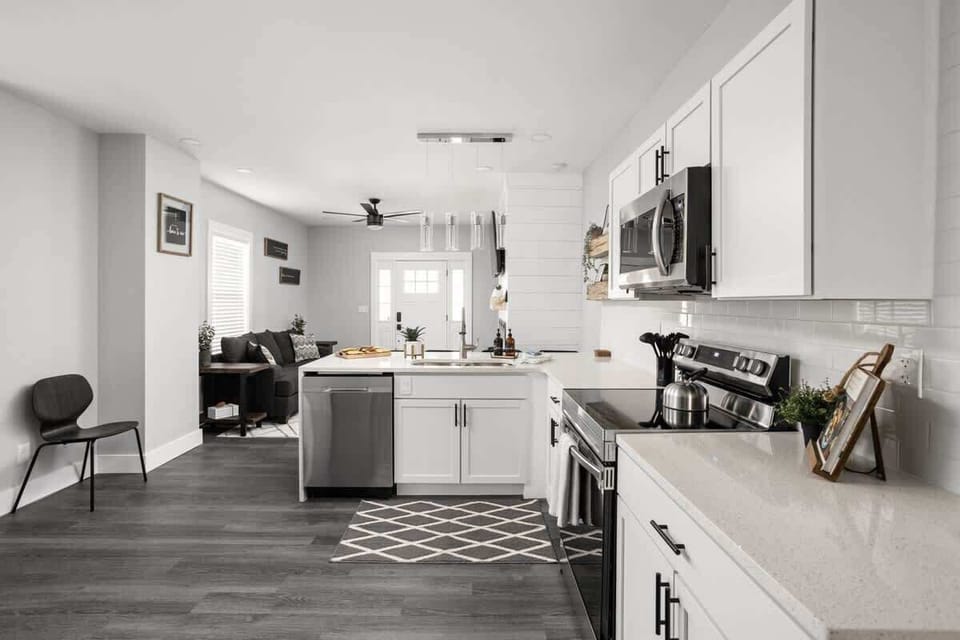 Kitchen: Modern kitchen space with sleek appliances, stylish decor, and inviting natural light!