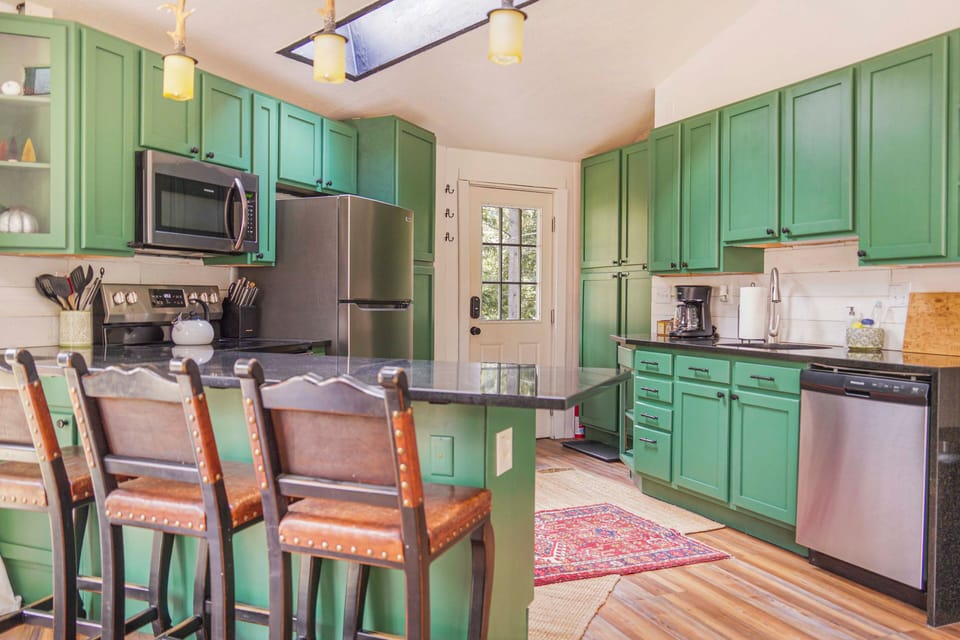 Kitchen with granite counters and new appliances.  