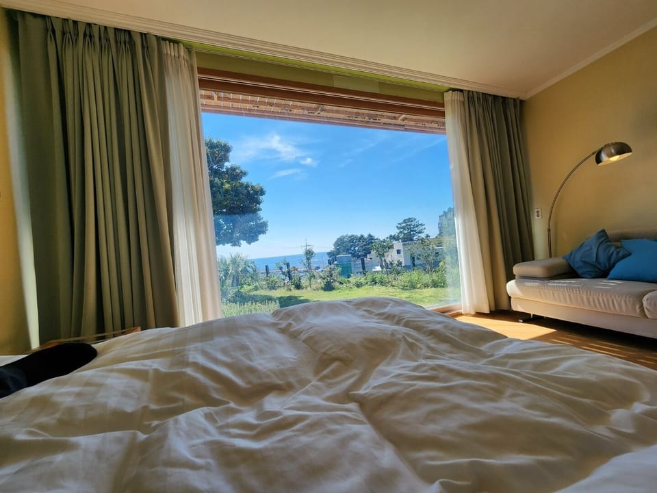 Ocean View Double Room | Egyptian cotton sheets, down comforters, laptop workspace, soundproofing