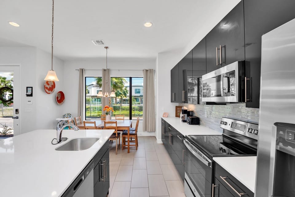 Sleek kitchen with stainless steel appliances. 